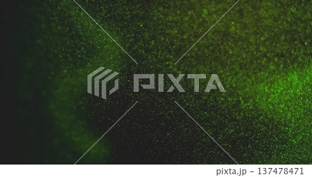 Defocused particles. Green light leak. Glimmer bright color glitter optical bokeh gleam vibrant twinkle on abstract art background. 137478471