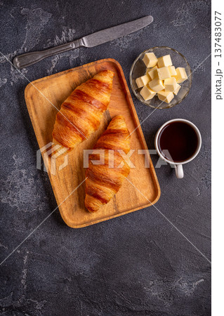 French croissant. Freshly baked croissants with butter coffee 137483077