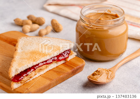Peanut paste in an open jar Peanut paste in an open jar 137483136