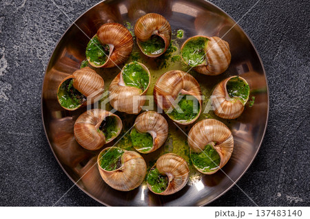 Bourgogne Escargot Snails with herb garlic oil. Bourgogne Escargot Snails with herb garlic oil. 137483140