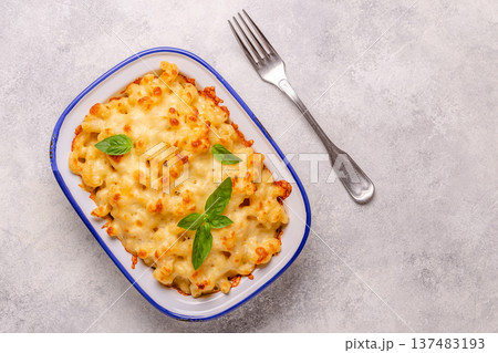 American mac and cheese, macaroni pasta in cheesy sauce American mac and cheese, macaroni pasta in cheesy sauce 137483193
