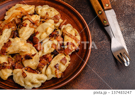 Dumplings, filled with mashed potatoes. 137483247