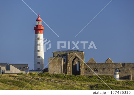 Pointe Saint Mathieu lighthouse illuminating Finistere coast in Brittany 137486330