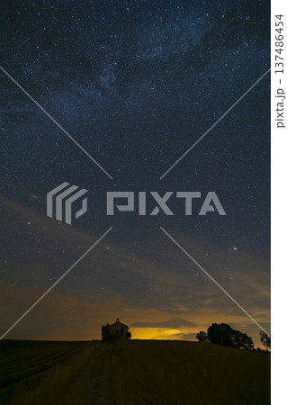 Milky Way stretching over isolated chapel at night Milky Way stretching over isolated chapel at night 137486454