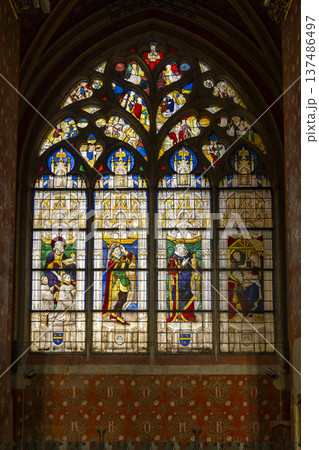 Ornate stained glass window depicting historical figures in Bourges 137486497