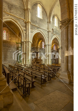 Avallon church interior showing ancient arches and wooden pews 137486531