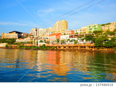 Cable car in tourist area. Coastal views of colorful buildings at waterfront in n Phu Quoc Island, 137486918