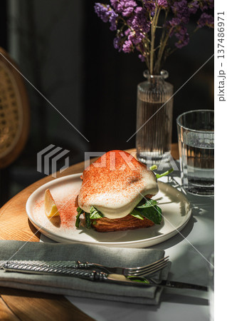 Salmon toast with poached egg and spinach 137486971