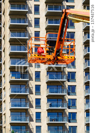 Basket lift on construction site Basket lift on construction site 137487516