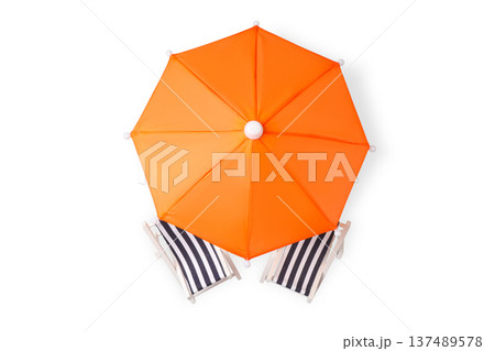 Orange umbrella stands above two striped beach chairs, PNG 137489578