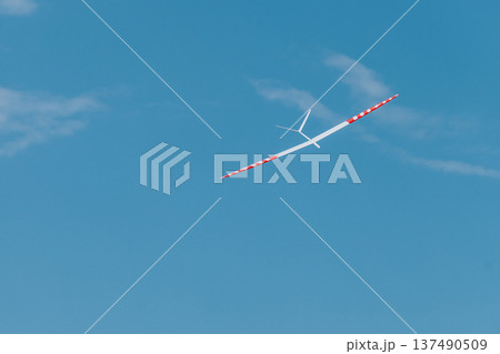 RC soaring plane on blue sky 137490509