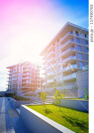 New modern block of flats, residential apartments. Flat buildings house. Apartments hotel complex. New modern block of flats, residential apartments. Flat buildings house. Apartments hotel complex. 137490768