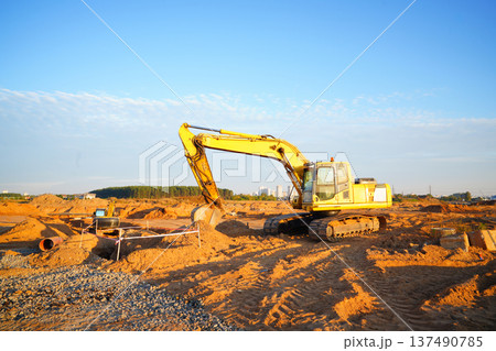 Excavator earthworks on construction site. Sewer line repair. Excavator groundwork water line repair Excavator earthworks on construction site. Sewer line repair. Excavator groundwork water line repair 137490785