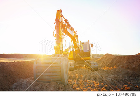 Excavator earthworks on construction site. Sewer line repair. Excavator groundwork water line repair 137490789