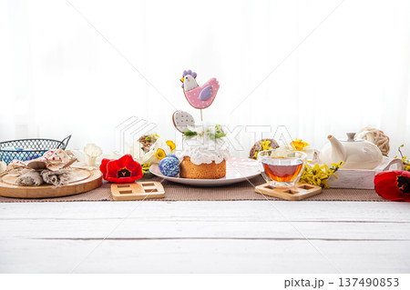 Festive Easter cake on the table among flowers and other details copy space. 137490853