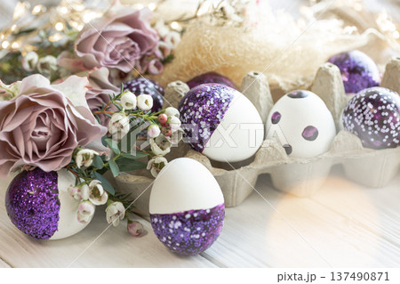Easter composition with decorative eggs and flowers, close-up. Easter composition with decorative eggs and flowers, close-up. 137490871