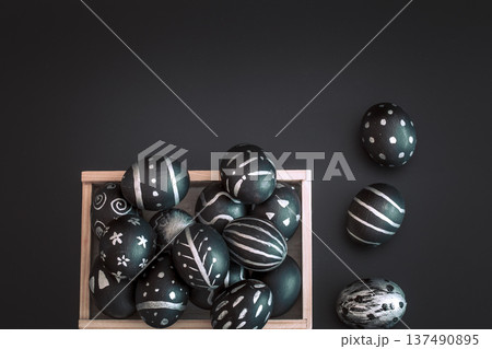 Easter composition with eggs in a wooden box Easter composition with eggs in a wooden box 137490895
