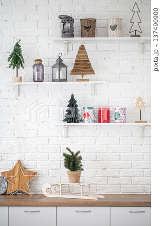 Decorative Christmas items in the interior of a modern kitchen. 137490900