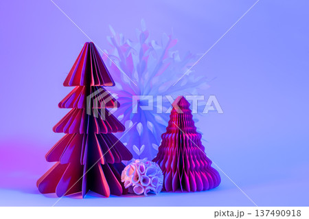Decorative paper Christmas trees on blue background with trendy neon light. Decorative paper Christmas trees on blue background with trendy neon light. 137490918