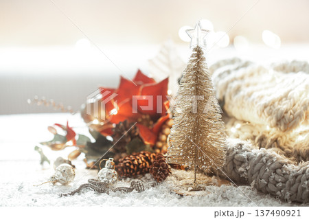 Christmas background with details of festive decor on a blurred background. Christmas background with details of festive decor on a blurred background. 137490921