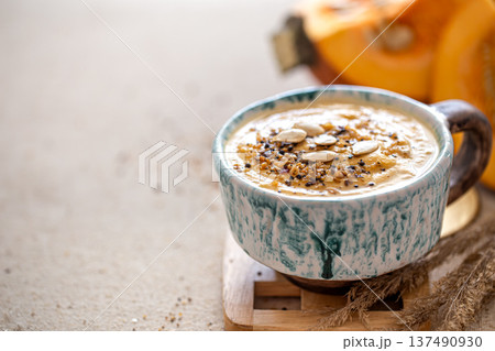 Close up shot of pumpkin soup in ceramic bowl. Close up shot of pumpkin soup in ceramic bowl. 137490930