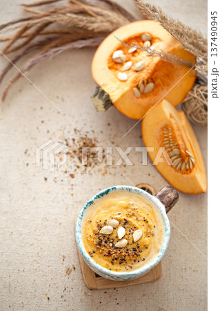 Appetizing composition with pumpkin soup top view. Appetizing composition with pumpkin soup top view. 137490945