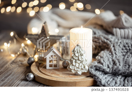 Cozy winter composition with decor details on blurred background with bokeh. Cozy winter composition with decor details on blurred background with bokeh. 137491028