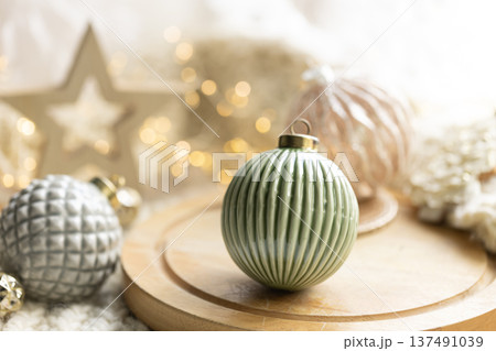 Cozy winter still life, Christmas decorations on cozy blanket. Cozy winter still life, Christmas decorations on cozy blanket. 137491039