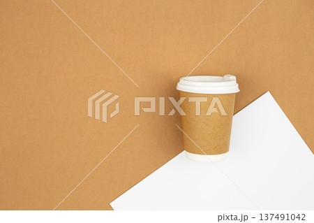 Craft paper coffee cup, eco background with copy space, top view. 137491042