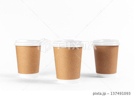 Disposable paper cups on a white background isolated. 137491093