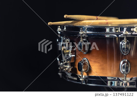 Drum close-up. Drumsticks with a drum. 137491122