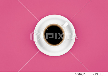 Cup of coffee and saucer on a pink background, flat lay. 137491198