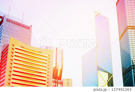 Skyscrapers in bright glass exteriors sunlight on sunset. Modern facade office buildings Skyscrapers in bright glass exteriors sunlight on sunset. Modern facade office buildings 137491263