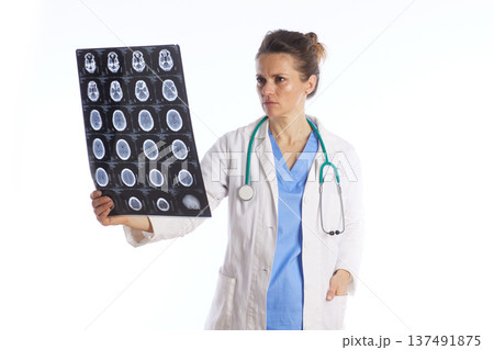 Concerned Female Doctor Reviewing Brain X-ray Scan Concerned Female Doctor Reviewing Brain X-ray Scan 137491875