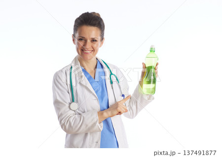 Female Physician Pointing to Healthy Nutritional Drink Female Physician Pointing to Healthy Nutritional Drink 137491877