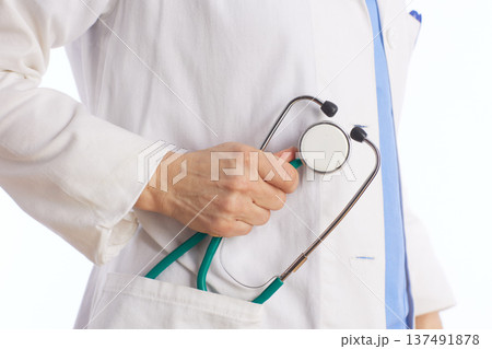 Healthcare Professional Holding Stethoscope Close Up Healthcare Professional Holding Stethoscope Close Up 137491878
