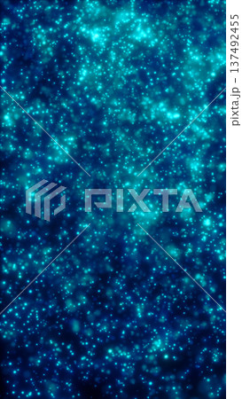 Abstract teal and blue glowing particle field with sparkling bokeh dots, creating a dreamy underwater or cosmic dust background with soft haze and depth 137492455