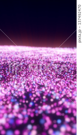 Shimmering pink and purple glitter bokeh particles creating a dreamy abstract background with soft focus lights and festive sparkle 137492470