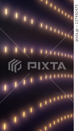 Warm golden dotted lights forming flowing lines on a dark background, elegant abstract glow pattern for festive and luxury designs Warm golden dotted lights forming flowing lines on a dark background, elegant abstract glow pattern for festive and luxury designs 137492475
