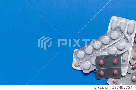 Blister pack of medicines on blue background Blister pack of medicines on blue background 137492754