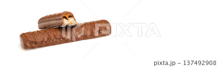Banner with copy space. A chocolate bar with a bite taken out of it Banner with copy space. A chocolate bar with a bite taken out of it 137492908