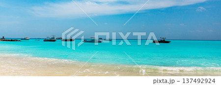 Banner with copy space. Turquoise waters meet golden sand Banner with copy space. Turquoise waters meet golden sand 137492924