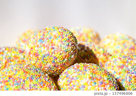 Colorful tactile Easter eggs sprinkled with sprinkles for a festive dessert and sweet celebration. copyspace 137496806