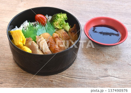 grilled chicken dressing Teriyaki Japanese sauce on rice with sweet egg and vegetable depping black sweet soy sauce bento set in lunchbox grilled chicken dressing Teriyaki Japanese sauce on rice with sweet egg and vegetable depping black sweet soy sauce bento set in lunchbox 137498976