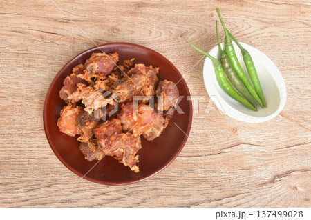 fried fermenting sour pork bone with garlic eat copple fresh chili on plate fried fermenting sour pork bone with garlic eat copple fresh chili on plate 137499028