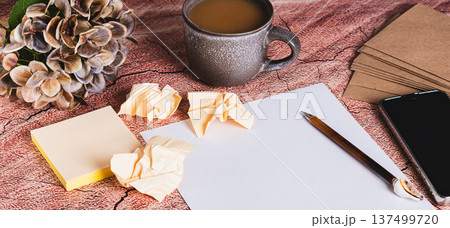 Concept of writing a resume for a job application, paper and pen on the table web banner 137499720