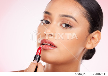 Beauty, makeup and red lipstick with portrait of woman in studio for cosmetics, glamour and product. Glow, self care and spa with face of person on pink background for salon, cosmetology and lip balm 137500251