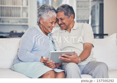 Happy, tablet and senior couple streaming movie or show with love, care and bonding in home living room together. Couch, app and elderly people relax and watching a subscription service on retirement 137500292