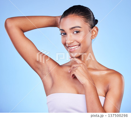 Armpit, epilation and woman in portrait with beauty, grooming and smile isolated on blue background. Hygiene, cleaning body and hair removal with skincare, cosmetics and dermatology in a studio Armpit, epilation and woman in portrait with beauty, grooming and smile isolated on blue background. Hygiene, cleaning body and hair removal with skincare, cosmetics and dermatology in a studio 137500298