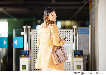 Smile, portrait and a woman with access to a station for travel, transport or or a train. Happy, airport and a girl or person with a boarding pass for a commute, electronic entrance or machine Smile, portrait and a woman with access to a station for travel, transport or or a train. Happy, airport and a girl or person with a boarding pass for a commute, electronic entrance or machine 137500412